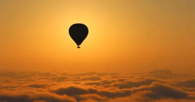 Hot air balloon Marrakech being prepared at sunrise in the desert